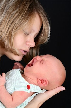 Beautiful mother with her newborn baby girl Stock Photo - Budget Royalty-Free & Subscription, Code: 400-05911842