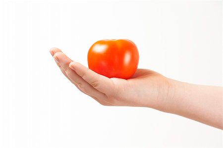 simsearch:400-04586134,k - Childs hand with tomatoe and palm facing up - on white background Stock Photo - Budget Royalty-Free & Subscription, Code: 400-05920022