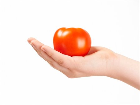 simsearch:400-04586134,k - Childs hand with tomatoe and palm facing up - on white background Stock Photo - Budget Royalty-Free & Subscription, Code: 400-05920023