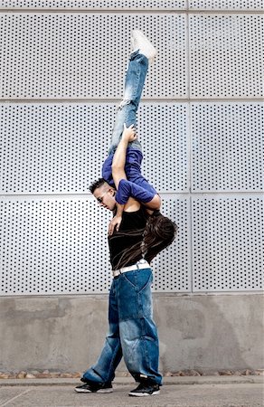 Young urban couple dancers hip hop dancing urban scene Stock Photo - Budget Royalty-Free & Subscription, Code: 400-05923825