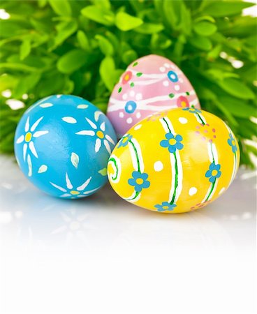 Easter eggs in the green grass isolated on white background Stock Photo - Budget Royalty-Free & Subscription, Code: 400-05933164