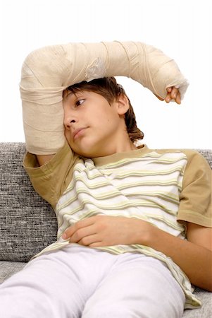 sad teenage caucasian boy with broken arm bone Stock Photo - Budget Royalty-Free & Subscription, Code: 400-05946804