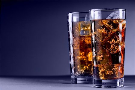 soda in glass - Photo of delicious cold glass with cola and ice cubes Stock Photo - Budget Royalty-Free & Subscription, Code: 400-06064633