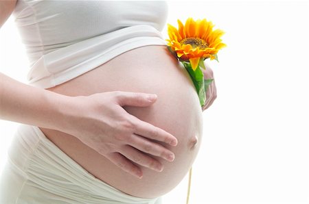 simsearch:400-05716366,k - Young Mother holding a sunflower on white background Stock Photo - Budget Royalty-Free & Subscription, Code: 400-06064935