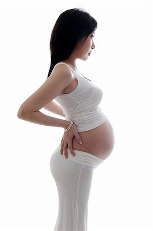 simsearch:400-05716366,k - Side view of pregnant lady on white background Stock Photo - Budget Royalty-Free & Subscription, Code: 400-06064946