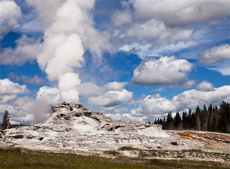 steam vent - A view of Castle Geyser in Upper Geyser Basin showing steam rising from the vent in the central cone which has formed over years of steady eruptions. This is one of the larger volcanic geysers in Yellowstone National Park. Stock Photo - Budget Royalty-Free & Subscription, Code: 400-06065201