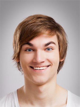 dude - Portrait of a handsome young man, over a gray background Stock Photo - Budget Royalty-Free & Subscription, Code: 400-06065851