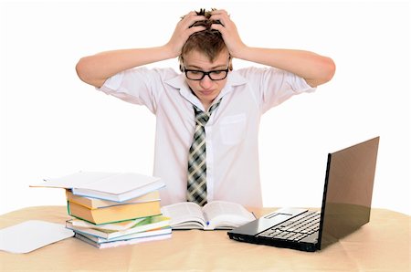 simsearch:400-04704759,k - teenager student sits behind a desk isolated on white background Stock Photo - Budget Royalty-Free & Subscription, Code: 400-06065869