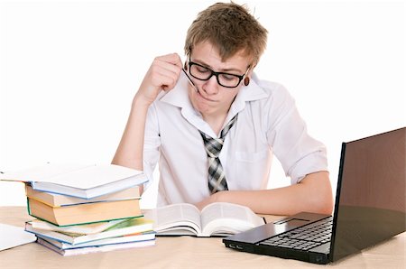 simsearch:400-04704759,k - frustrated student sits behind a desk isolated on white background Stock Photo - Budget Royalty-Free & Subscription, Code: 400-06065872