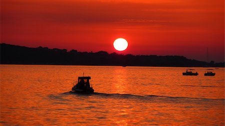 simsearch:400-07748817,k - Fishermen silhouette on sea at red sunset near Brioni nationl park Stock Photo - Budget Royalty-Free & Subscription, Code: 400-06066236