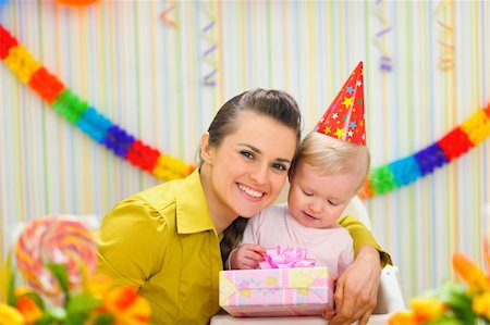 Portrait of mother with baby celebrating first birthday Stock Photo - Budget Royalty-Free & Subscription, Code: 400-06067049