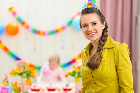 Portrait of mother and celebrating baby in background Stock Photo - Budget Royalty-Free & Subscription, Code: 400-06067059