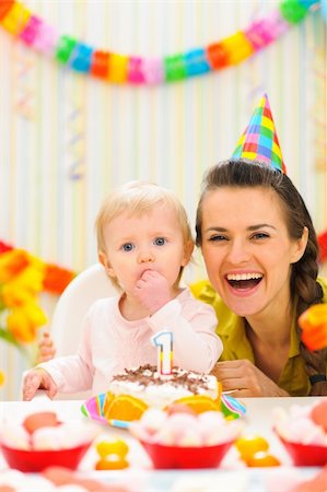 Portrait of mother with baby enjoying first birthday cake Stock Photo - Budget Royalty-Free & Subscription, Code: 400-06067069
