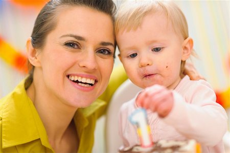Portrait of mom and baby eating birthday cake Stock Photo - Budget Royalty-Free & Subscription, Code: 400-06067075