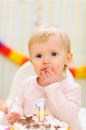 first birthday baby - Portrait of eat smeared baby eating first birthday cake Stock Photo - Budget Royalty-Free & Subscription, Code: 400-06067077