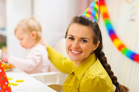 Portrait of happy mother celebrating baby first birthday Stock Photo - Budget Royalty-Free & Subscription, Code: 400-06067072