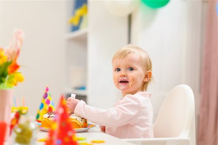 first birthday baby - Portrait of eat smeared kid eating birthday cake Stock Photo - Budget Royalty-Free & Subscription, Code: 400-06067083