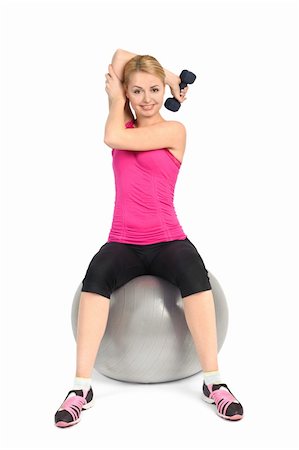 pictures of female athletes bending over - Young woman doing Seated Dumbbell One Arm Triceps Extensions on Fitnes Ball, phase 1 of 2. Stock Photo - Budget Royalty-Free & Subscription, Code: 400-06068896