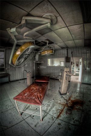 empty inside of hospital rooms - surgery room of an abandoned hospital with medical equipment and blood on the floor Stock Photo - Budget Royalty-Free & Subscription, Code: 400-06069498