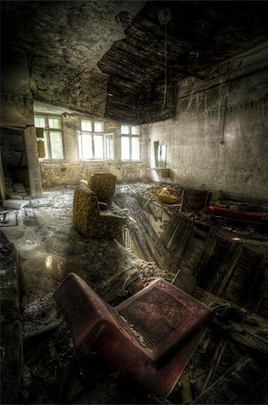 empty old living room - room in an abandoned complex with different old chairs and a broken floor Stock Photo - Budget Royalty-Free & Subscription, Code: 400-06069507