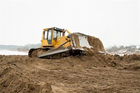 simsearch:700-05662628,k - bulldozer loader at winter frozen soil excavation works Stock Photo - Budget Royalty-Free & Subscription, Code: 400-06062383