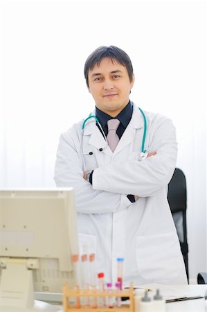 strong man test image - Portrait of medical doctor standing at table Stock Photo - Budget Royalty-Free & Subscription, Code: 400-06062804