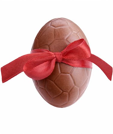 Chocolate easter egg with a red ribbon isolated on white Stock Photo - Budget Royalty-Free & Subscription, Code: 400-06062938