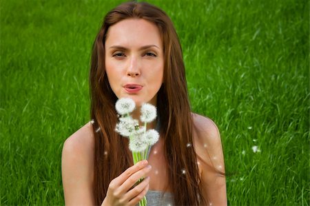 simsearch:400-04399510,k - Girl with dandelion on green field Stock Photo - Budget Royalty-Free & Subscription, Code: 400-06063062