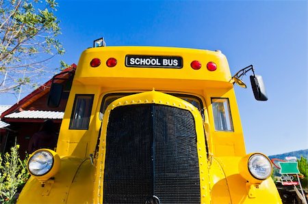 Yellow school bus against blue sky Stock Photo - Budget Royalty-Free & Subscription, Code: 400-06063162