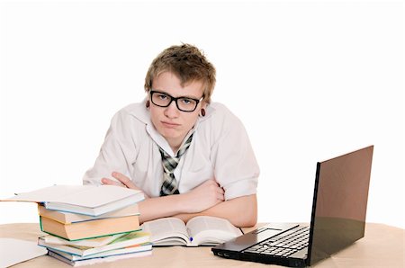 simsearch:400-04704759,k - teenager student sits behind a desk isolated on white background Stock Photo - Budget Royalty-Free & Subscription, Code: 400-06063559