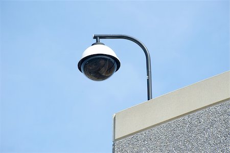 High tech overhead security camera on commercial building Stock Photo - Budget Royalty-Free & Subscription, Code: 400-06074071