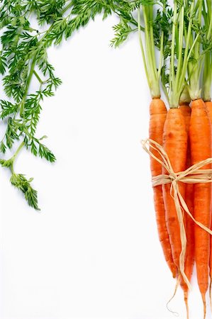 simsearch:400-05370250,k - Bunch of ripe carrots on a white background. Stock Photo - Budget Royalty-Free & Subscription, Code: 400-06074532