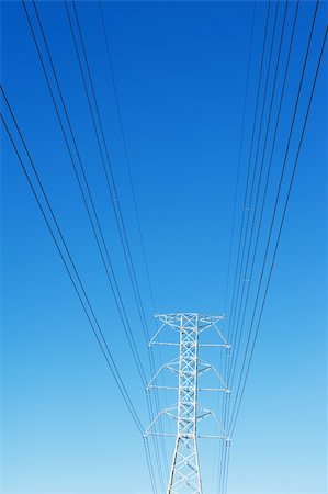 electrical energy hazard - High voltage power pole against blue sky Stock Photo - Budget Royalty-Free & Subscription, Code: 400-06074941
