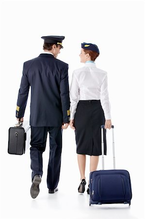 The pilot and stewardess with a suitcase on a white background Stock Photo - Budget Royalty-Free & Subscription, Code: 400-06075890