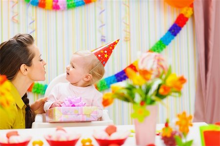 Mother giving birthday present for baby Stock Photo - Budget Royalty-Free & Subscription, Code: 400-06076004