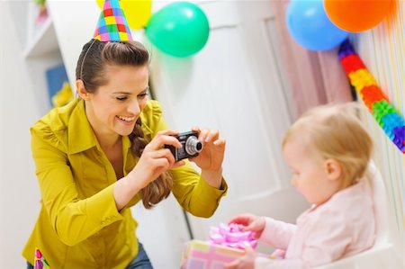 Mother making photos at babies birthday party Stock Photo - Budget Royalty-Free & Subscription, Code: 400-06076009