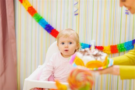 Mom carries cake for surprised baby Stock Photo - Budget Royalty-Free & Subscription, Code: 400-06076016