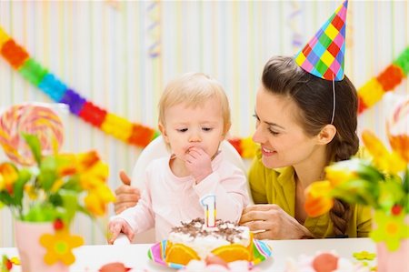 Portrait of happy mom and baby eating birthday cake Stock Photo - Budget Royalty-Free & Subscription, Code: 400-06076017