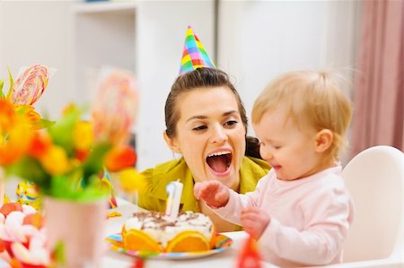 Mother and baby having fun at birthday party Stock Photo - Budget Royalty-Free & Subscription, Code: 400-06076018