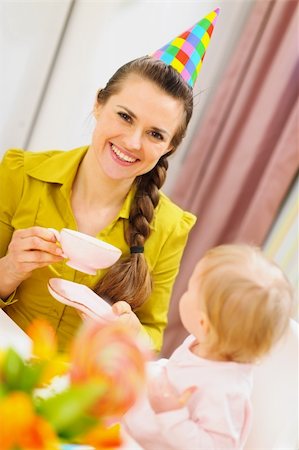 Mother drinking tea on babies birthday party Stock Photo - Budget Royalty-Free & Subscription, Code: 400-06076022