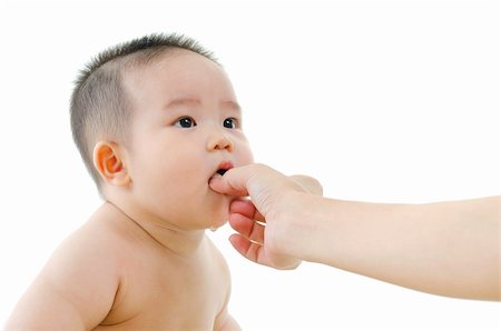 simsearch:400-07171482,k - Mum feeding Asian baby snacks on white background Stock Photo - Budget Royalty-Free & Subscription, Code: 400-06077326