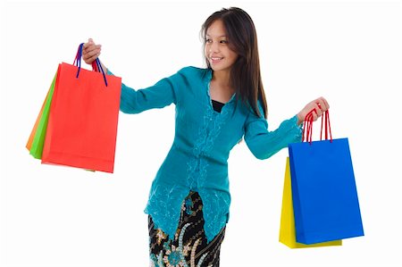 simsearch:656-03241003,k - Woman in tradition Kebaya holding colorful shopping bag. Stock Photo - Budget Royalty-Free & Subscription, Code: 400-06077329