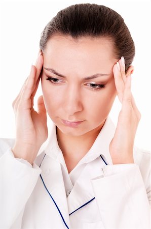 distressed female physician - Doctor with headache isolated on white background Stock Photo - Budget Royalty-Free & Subscription, Code: 400-06077939