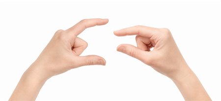 small hand big hand - Two woman hand's measuring invisible items. Isolated on white. Stock Photo - Budget Royalty-Free & Subscription, Code: 400-06070109