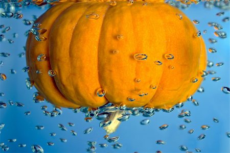 Pumpkin in a water drop tank with air bubbles Stock Photo - Budget Royalty-Free & Subscription, Code: 400-06072233