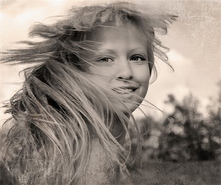 Retro style photo of happy girl with flying hair Stock Photo - Budget Royalty-Free & Subscription, Code: 400-06072578