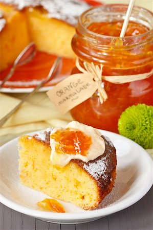 simsearch:400-04370315,k - Sweet orange cake and jar of marmalade for breakfast. Stock Photo - Budget Royalty-Free & Subscription, Code: 400-06072798