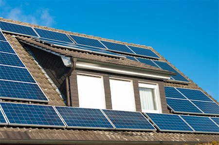 solar panel home - roof of a house covered with solar panels Stock Photo - Budget Royalty-Free & Subscription, Code: 400-06073331