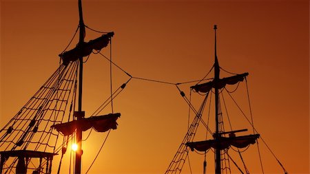 simsearch:400-05666303,k - Silhouettes of old-fashioned masts against a twilight sky, suggesting the idea of navigation. Stock Photo - Budget Royalty-Free & Subscription, Code: 400-06073490
