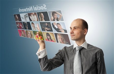 Businessman pressing social buttons on a virtual background Stock Photo - Budget Royalty-Free & Subscription, Code: 400-06084252